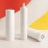 Three white water purifier cartridges displayed on a clean surface with a red and yellow abstract background inspired by the China flag.